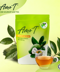 A package of Amo'T Pure Soursop Leaf Tea in a bright green stand-up pouch, shown with a glass cup of brewed tea and soursop leaves on a pale yellow-green background. The Amo'T brand logo is visible at the top left, and the pouch features illustrations of a soursop fruit and leaves.